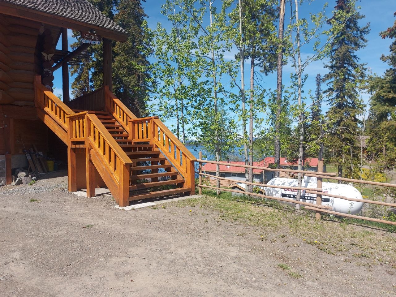 Community members grilling at a screened-in lakeside BBQ house at Lifechanyuan's Canada resort home, ...